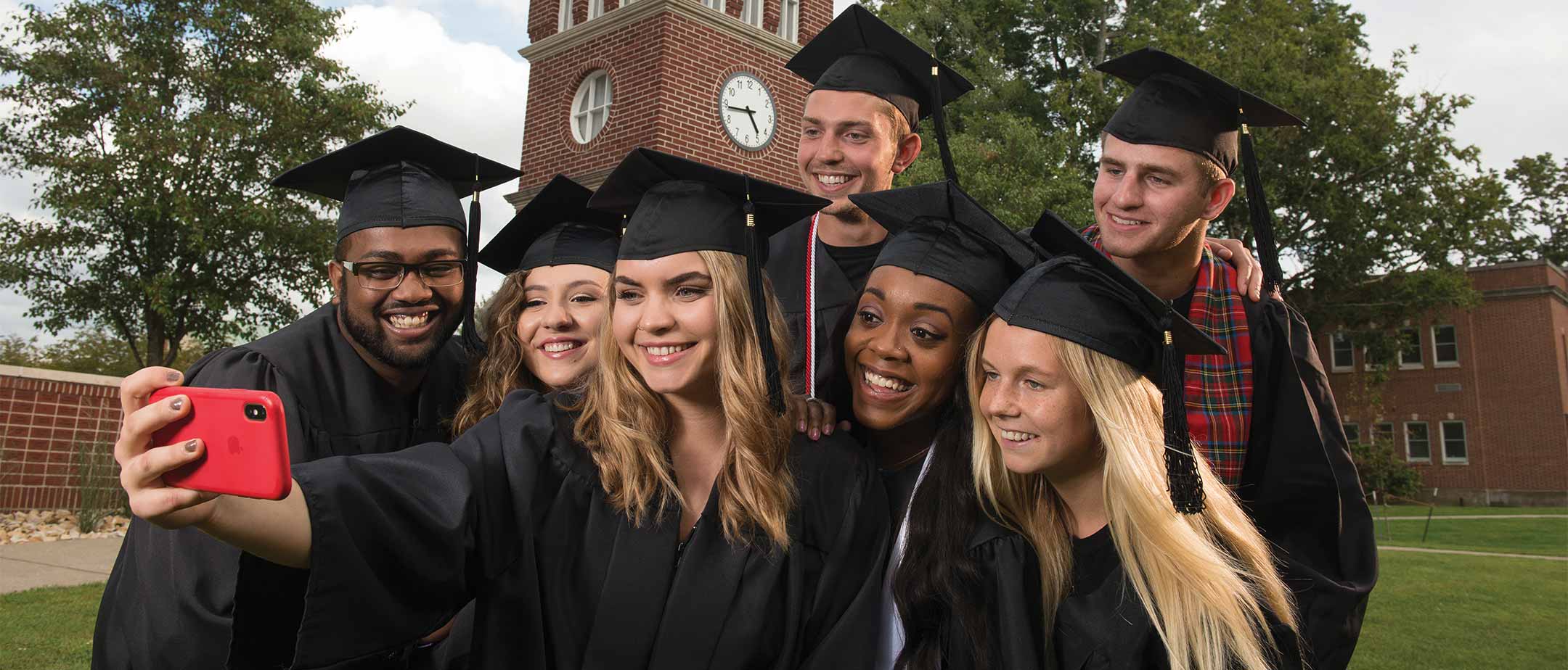 Graduating students posing for a selfie 