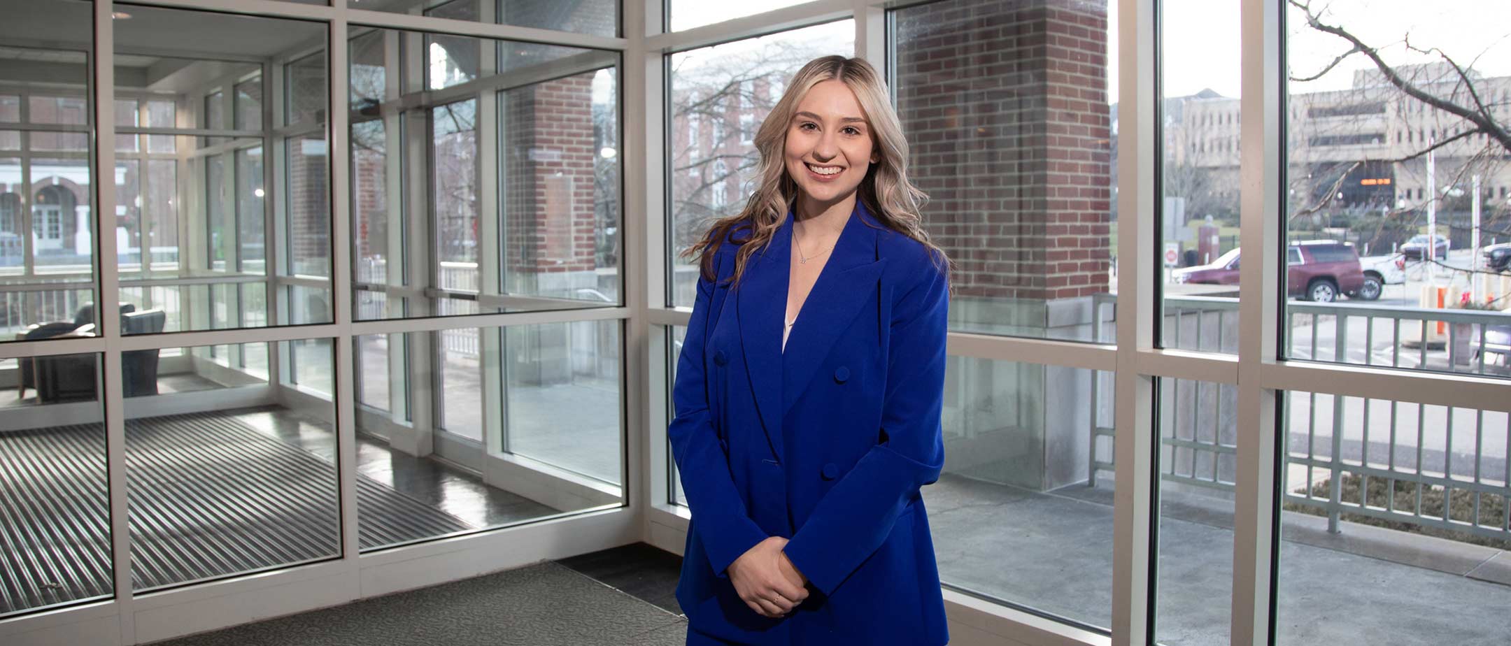 Student Mattie Sloneker, poses n the lobby of Eberly Hall.