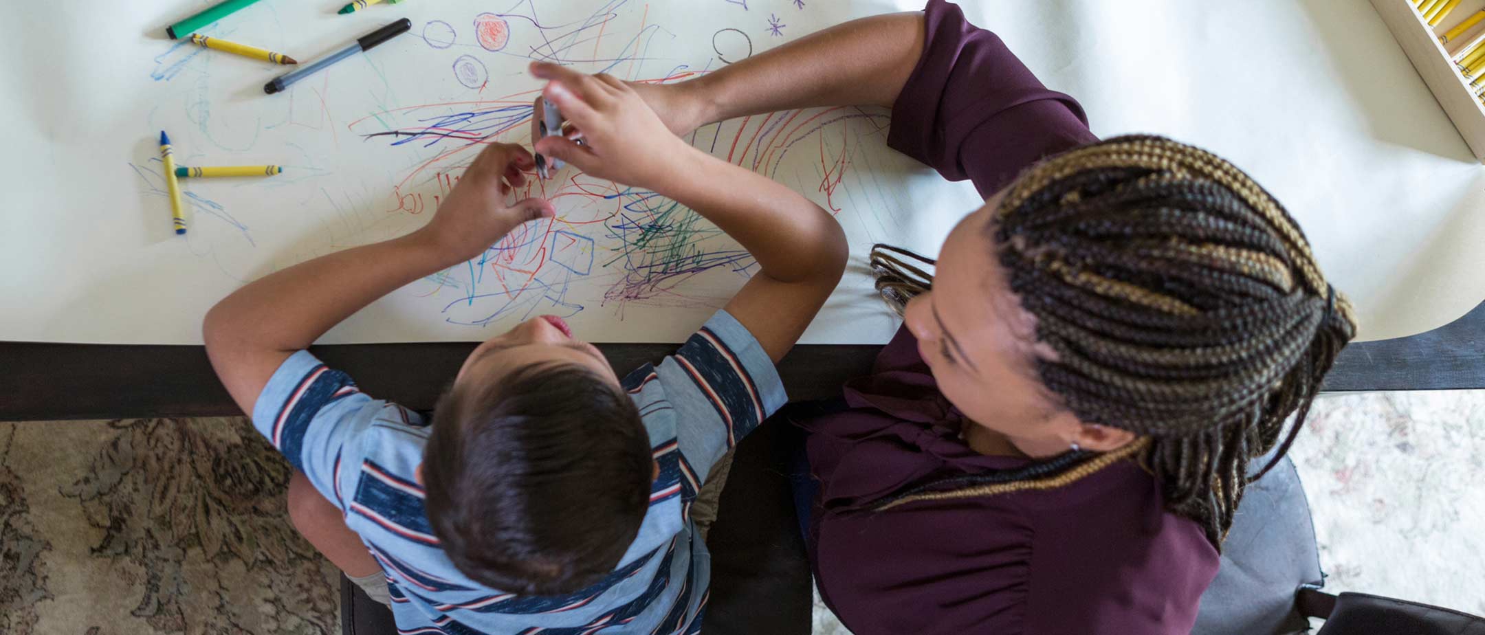 A student teacher works with a child in a classroom at Pennsylvania Western University (PennWest)