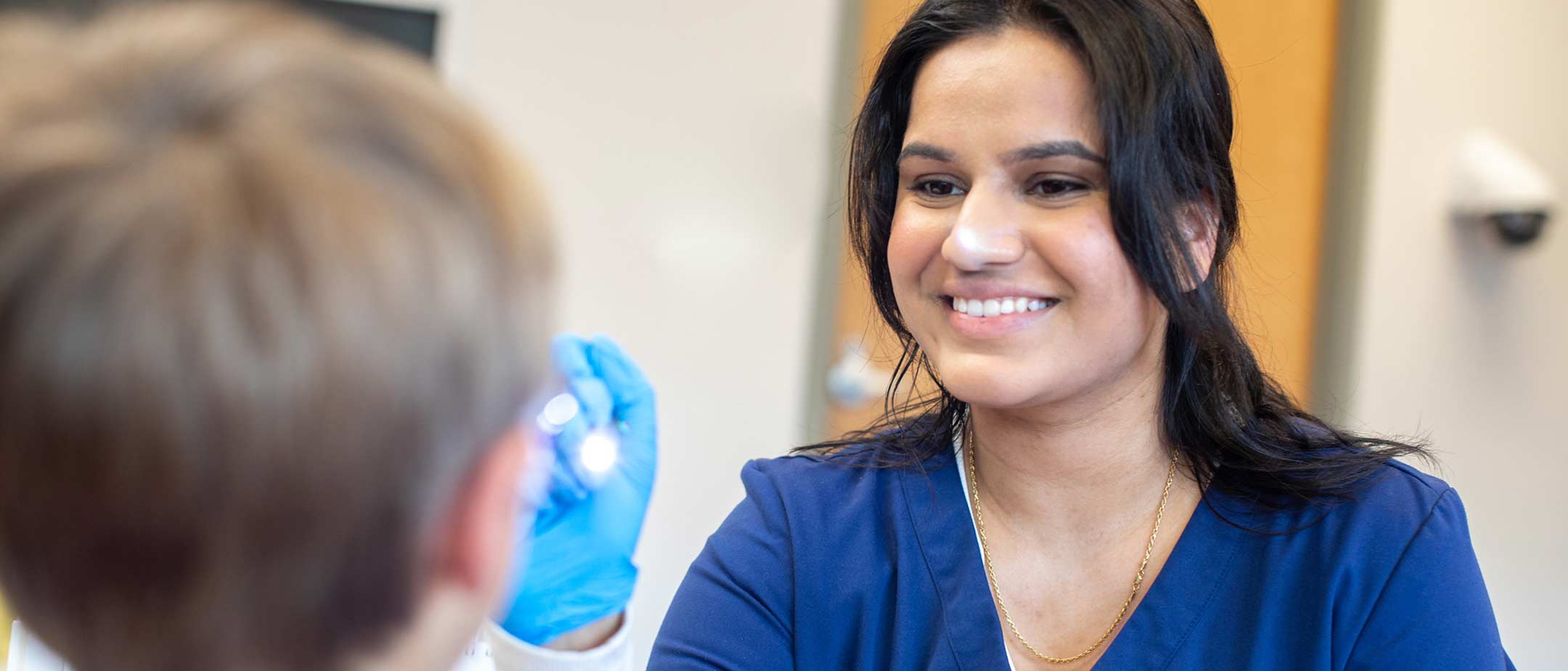 A student examining a patient