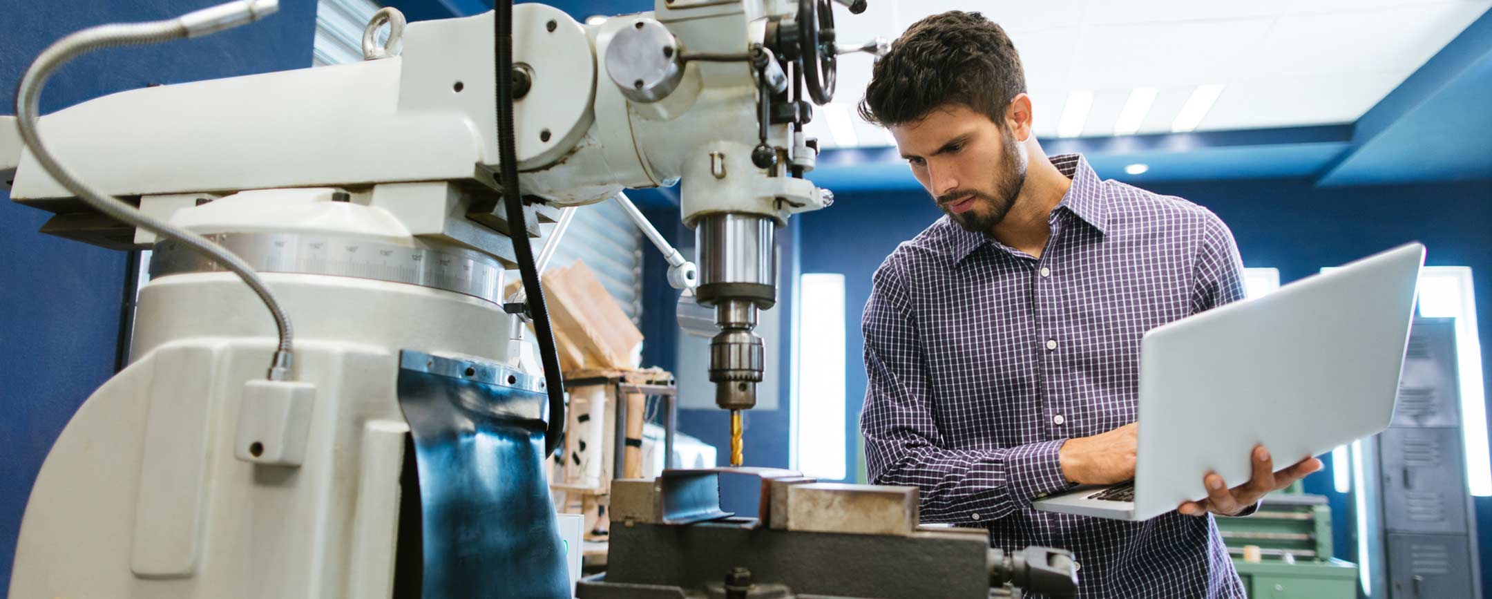 Applied technology student using robotics machines.