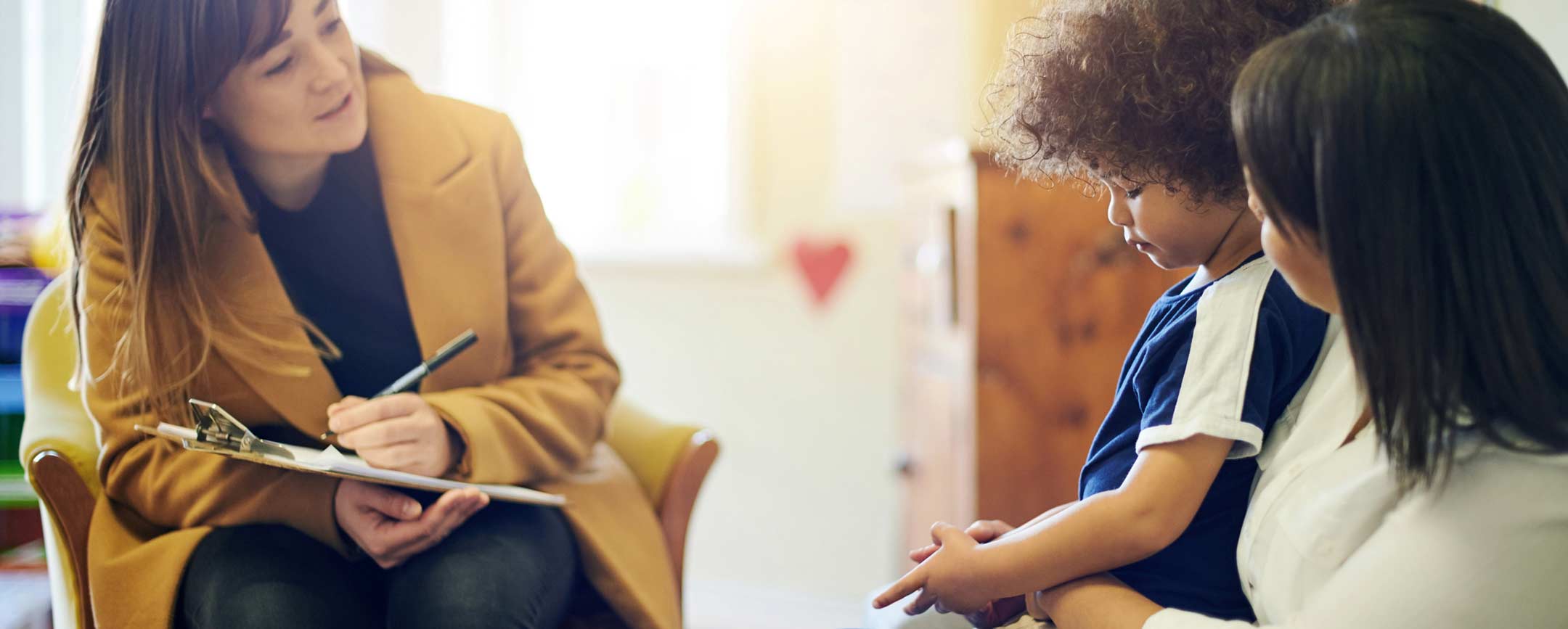 A human services worker with mom and child