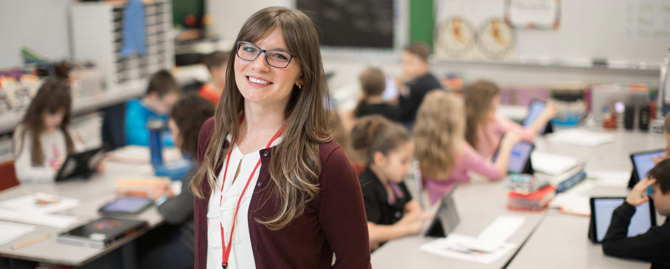 A PennWest education student working in a classroom.