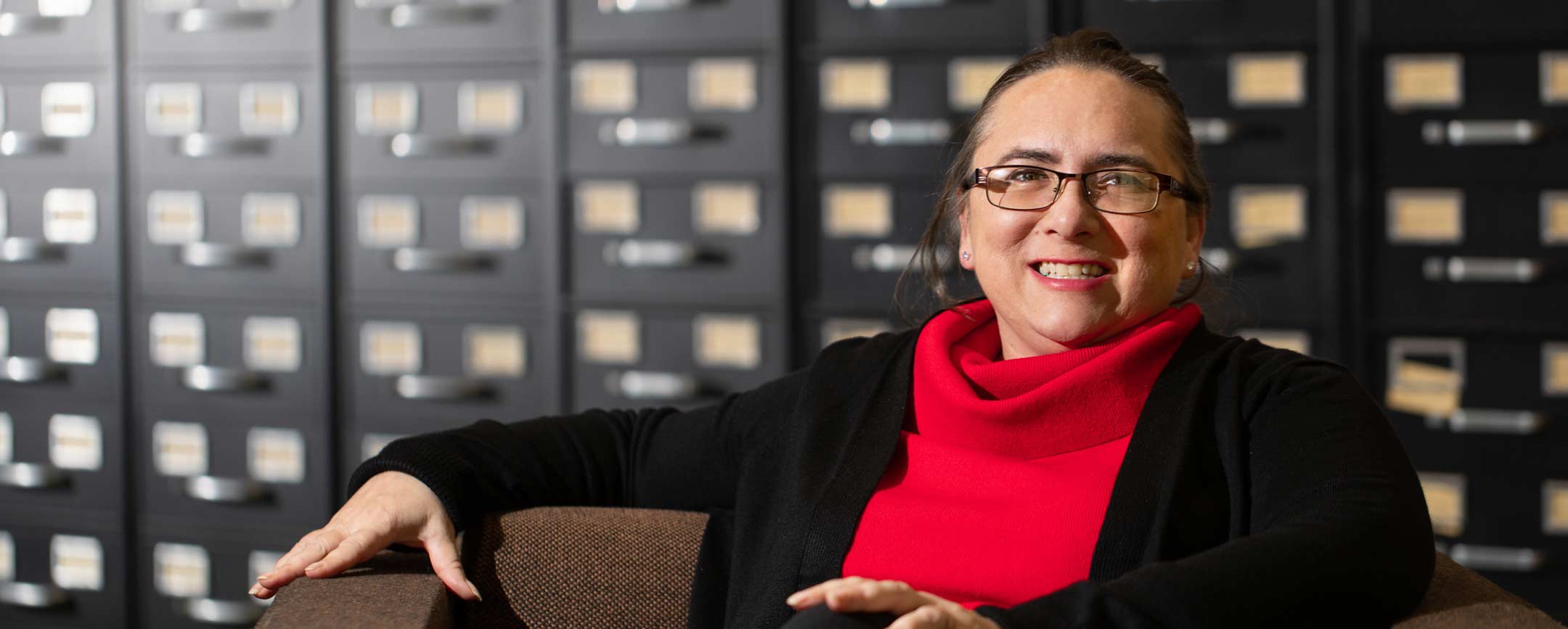 A professor sitting in a chair