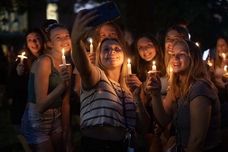 New students undergo a candlelight ceremony at PennWest California. 