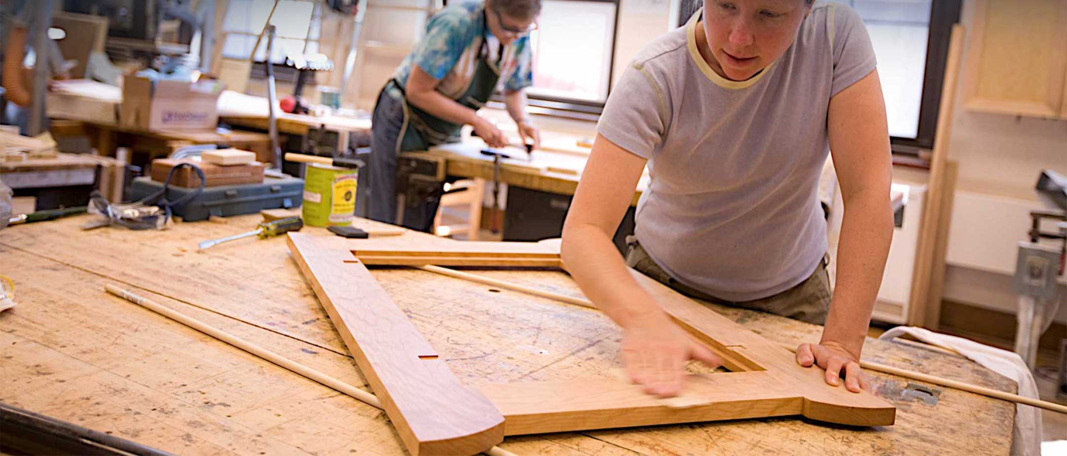 Students working in a wood/furniture class