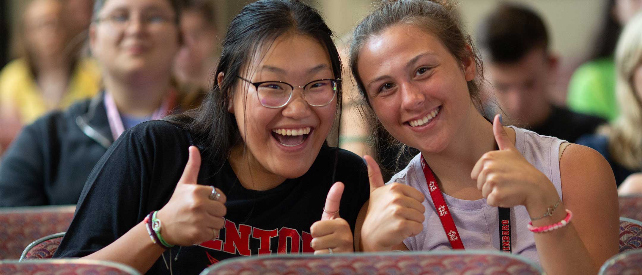 Students giving a thumbs up