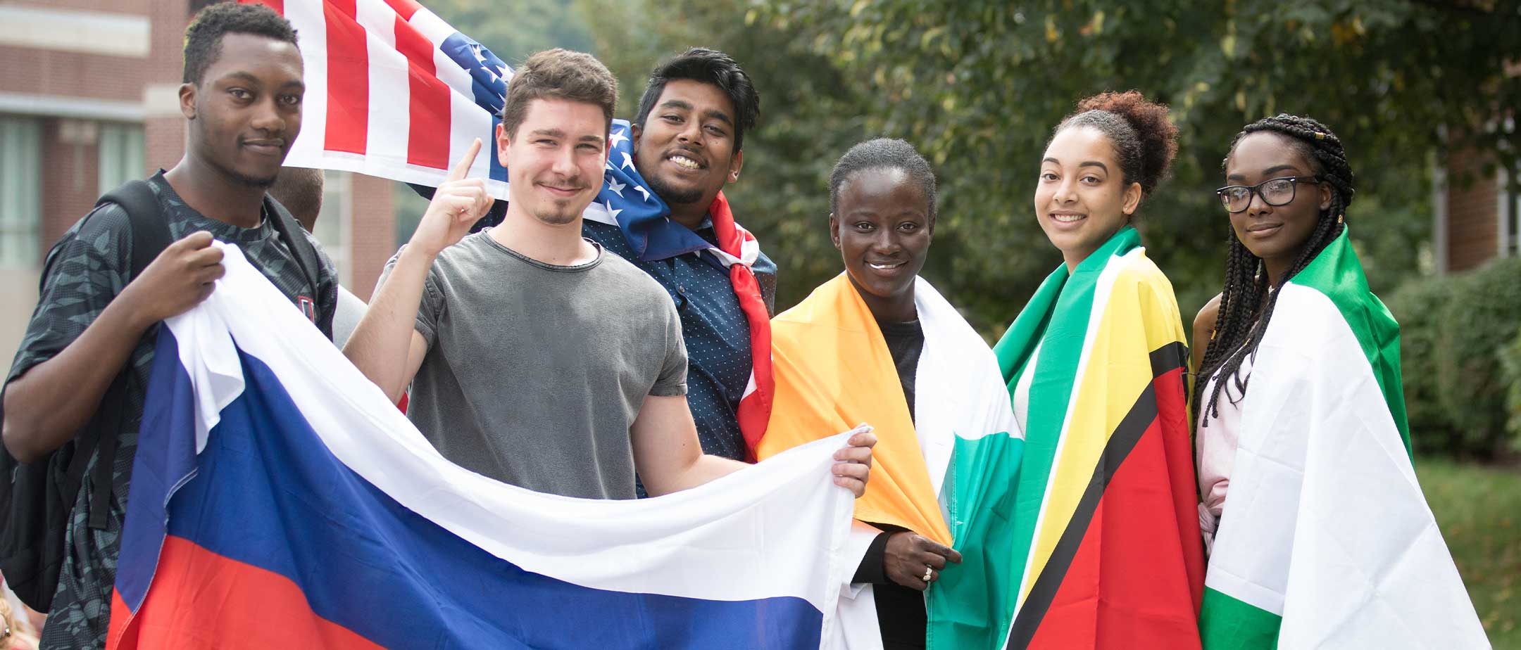 Students holding various flags