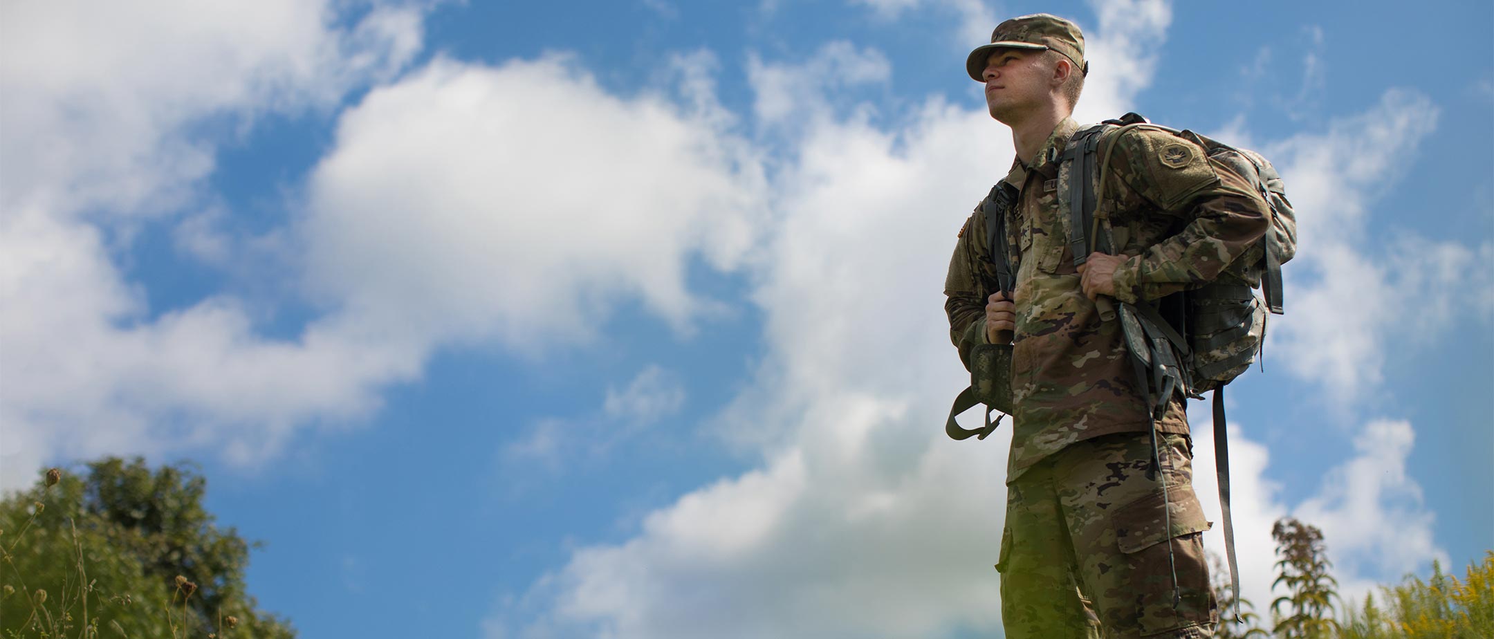 Military student standing in the grass