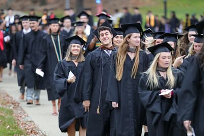 Graduates walking across campus at PennWest Clarion.