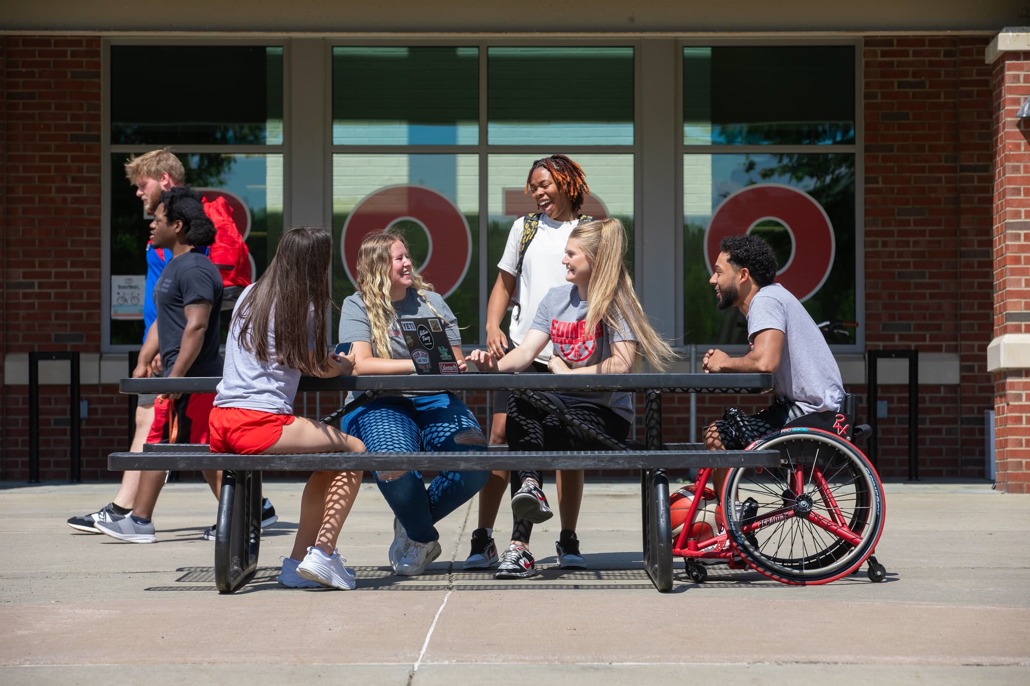 PennWest Edinboro students sitting on campus. 