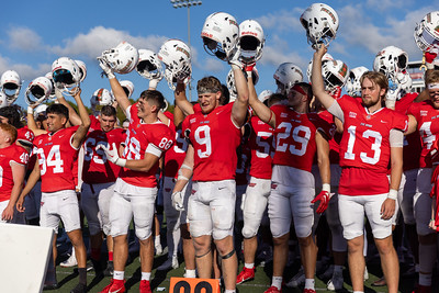 Edinboro football team saluting fans.