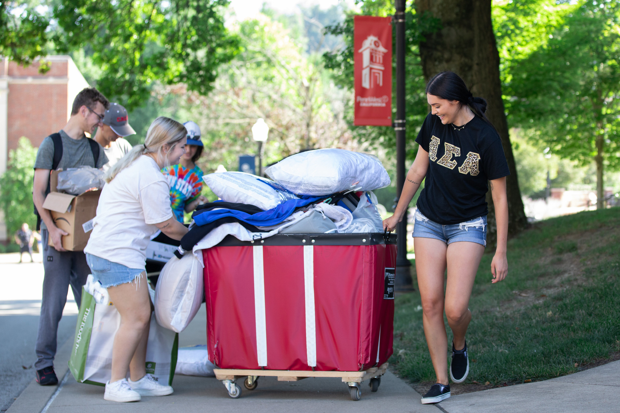 PW Cal Students Moving in with the help of a cart