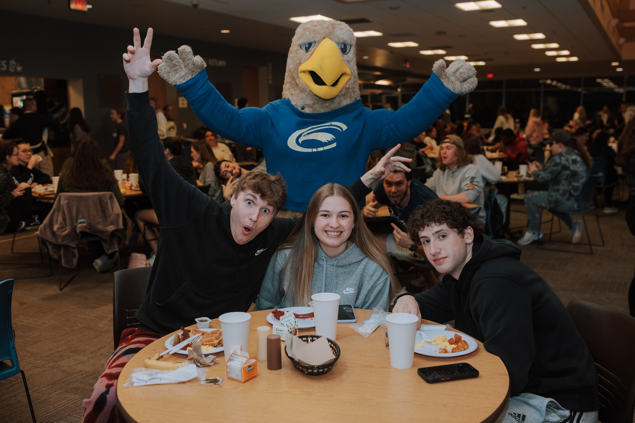 Students Enjoying Breakfast at Midnight with Ernie the Eagle