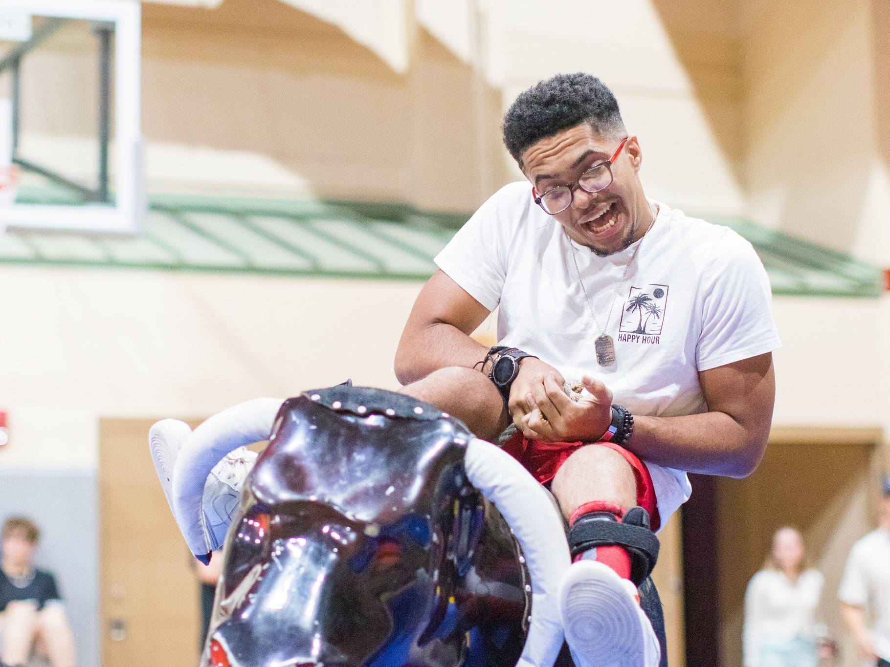 Student riding a mechanical bull during Pogue Palooza