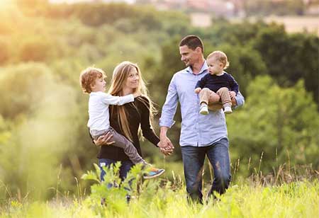 A family walking in a field