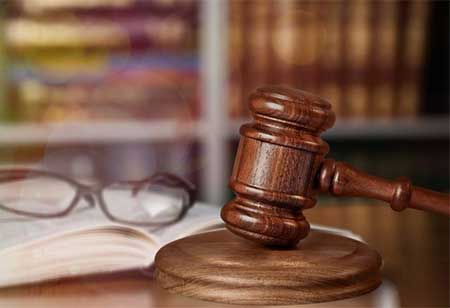 A gavel resting on a desk