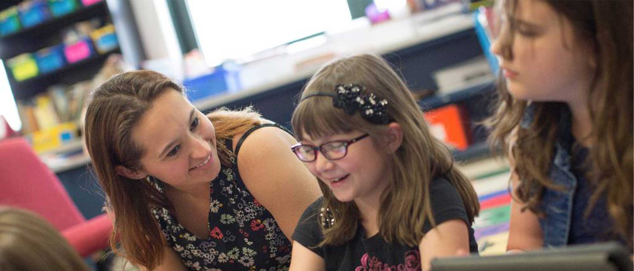 A teacher helping a student