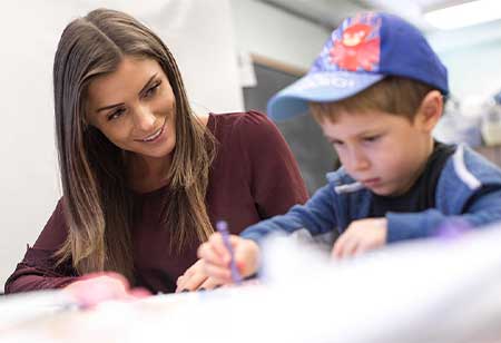 A teacher helping a student