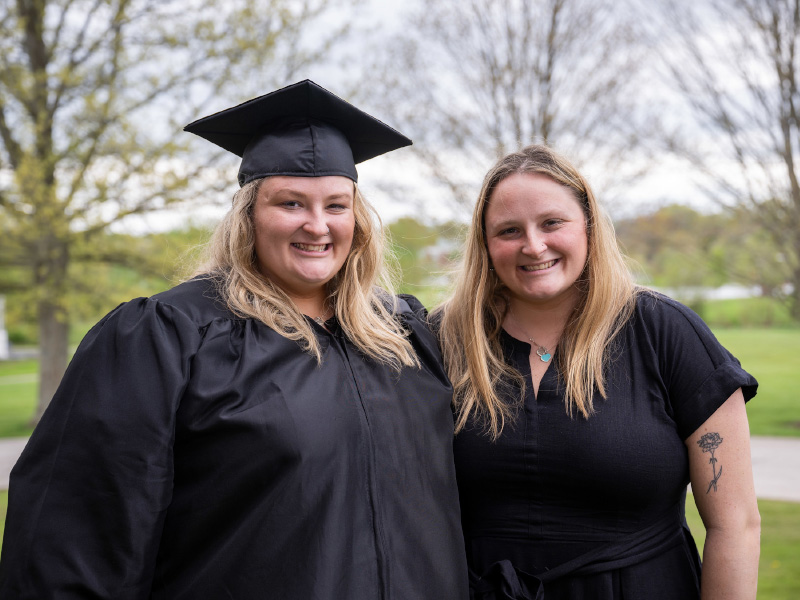 Hannah and Isabella Gorrell pose for a photo at graduation.