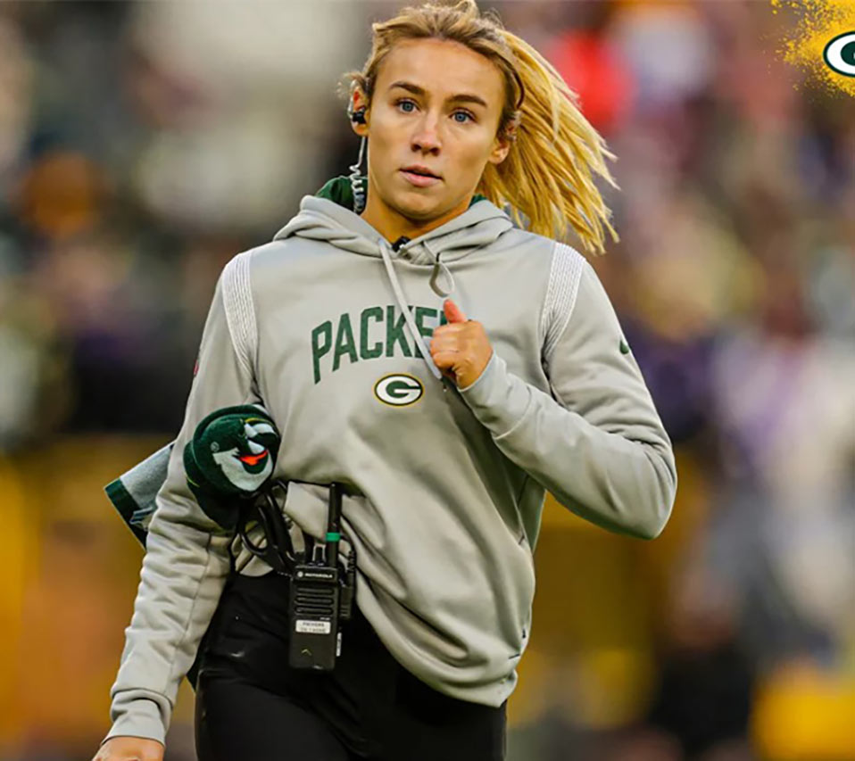 Erin Roberge running down the Green Bay Packer's field.