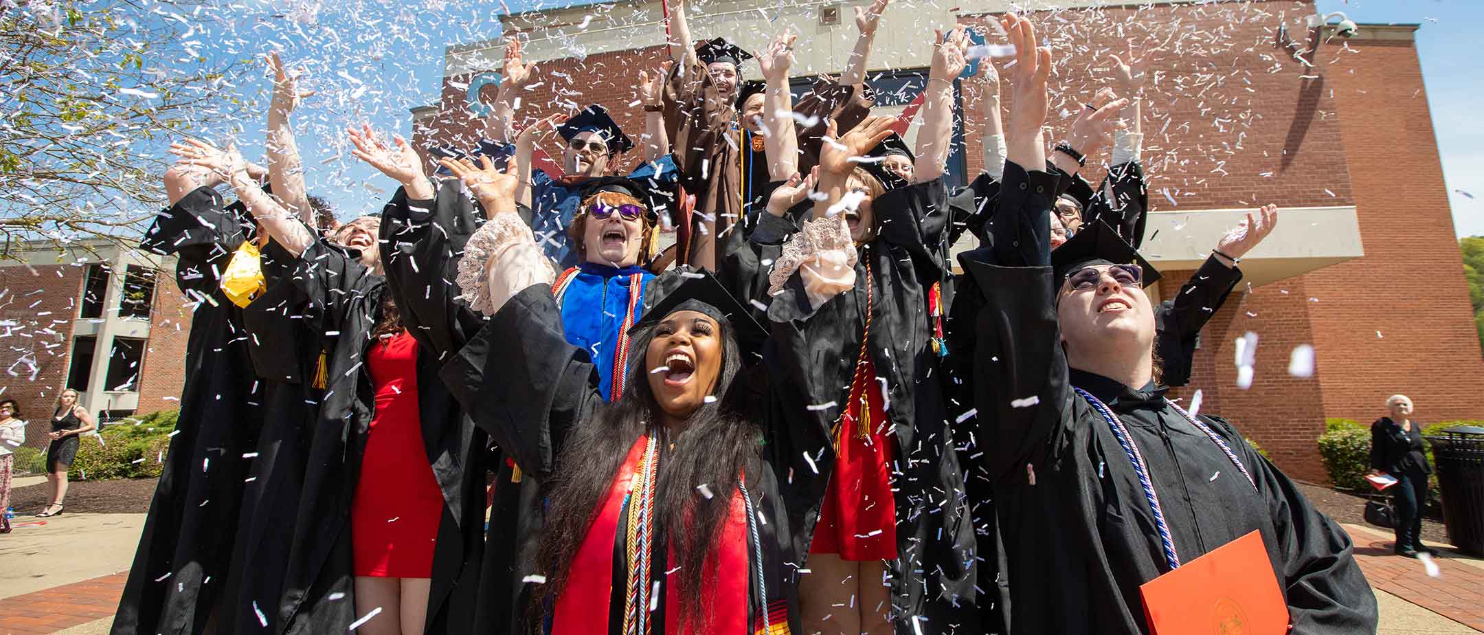 Students celebrating after graduation