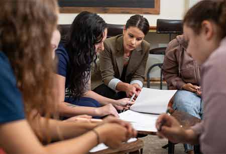 A professor teaching a group of students