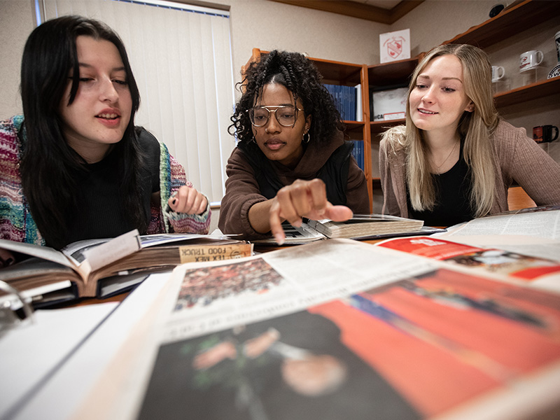 PennWest student look at archive collection in the history program.